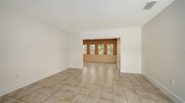 755 Edgemere Ln, Sarasota, FL 34242 - spare room featuring light tile patterned flooring and baseboards