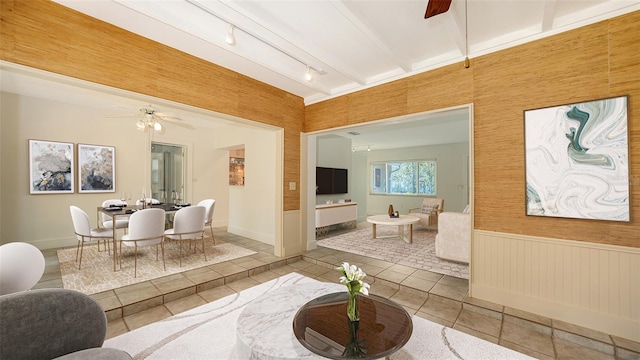 755 Edgemere Ln, Sarasota, FL 34242 - tiled living room featuring ceiling fan, wainscoting, and track lighting