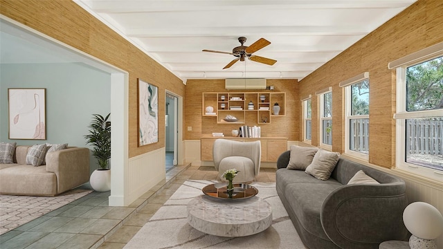 755 Edgemere Ln, Sarasota, FL 34242 - living room featuring a wainscoted wall, ceiling fan, beamed ceiling, and light tile patterned floors