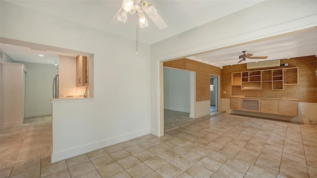 755 Edgemere Ln, Sarasota, FL 34242 - unfurnished living room with ceiling fan, a wall unit AC, and baseboards