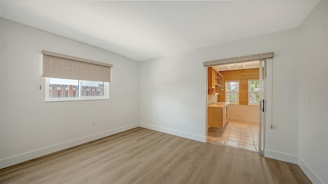 755 Edgemere Ln, Sarasota, FL 34242 - empty room with light wood-style floors and baseboards