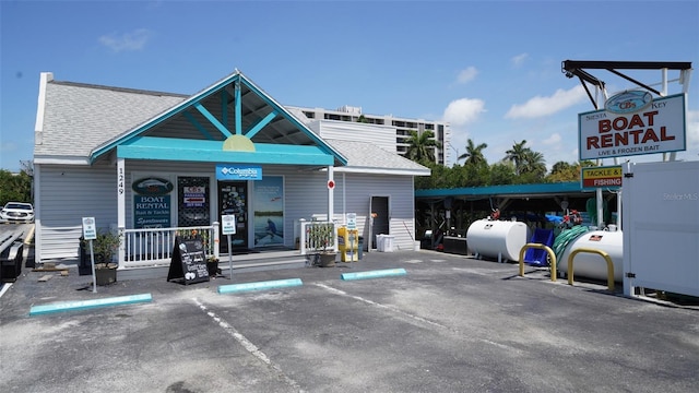 755 Edgemere Ln, Sarasota, FL 34242 - view of building exterior featuring heating fuel and uncovered parking