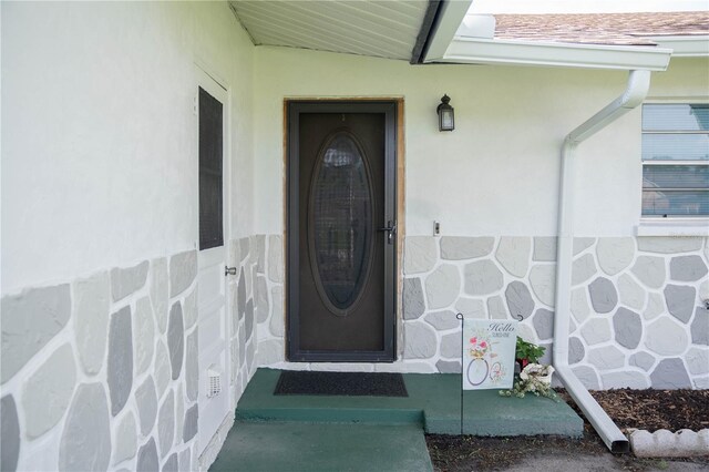 1004 65th Ave W, Bradenton, FL 34207 - doorway to property featuring stucco siding