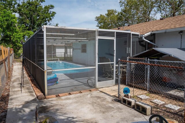 1004 65th Ave W, Bradenton, FL 34207 - view of swimming pool with a patio and glass enclosure