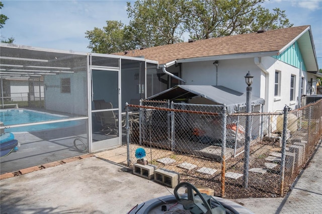 1004 65th Ave W, Bradenton, FL 34207 - back of house featuring roof with shingles, a patio, and a lanai