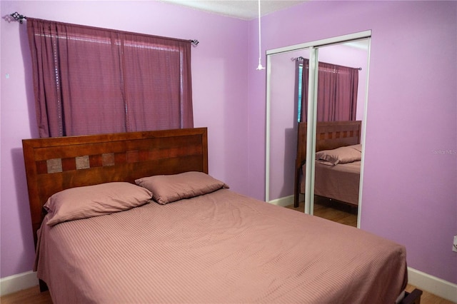 1004 65th Ave W, Bradenton, FL 34207 - bedroom featuring a closet and wood finished floors