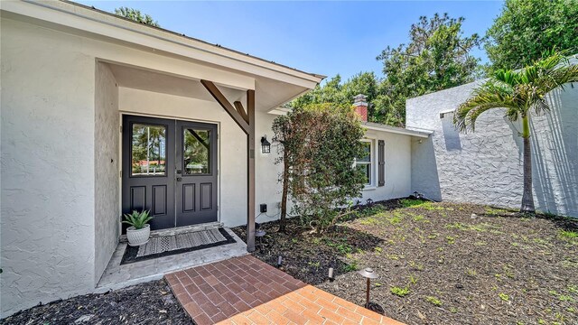 6990 Richardson Rd, Sarasota, FL 34240 - property entrance featuring stucco siding