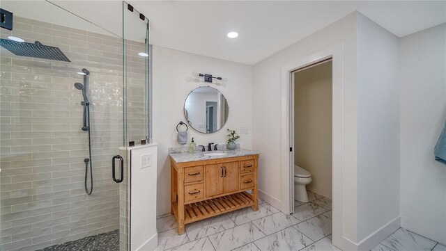 6990 Richardson Rd, Sarasota, FL 34240 - full bathroom with marble look tiles, a shower stall, vanity, toilet, and baseboards