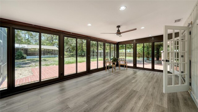 6990 Richardson Rd, Sarasota, FL 34240 - unfurnished sunroom featuring french doors, ceiling fan, wood finished floors, and recessed lighting
