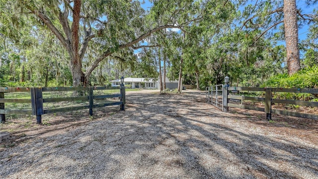 6990 Richardson Rd, Sarasota, FL 34240 - view of dirt / gravel driveway with a gated entry