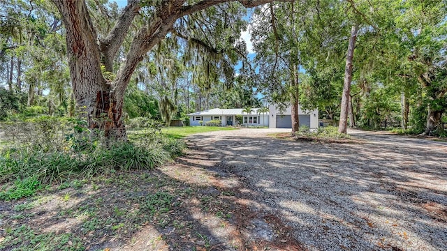 6990 Richardson Rd, Sarasota, FL 34240 - view of front of home featuring a garage and driveway