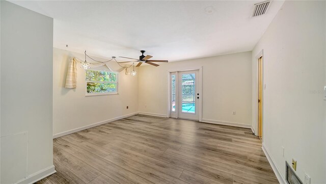 6990 Richardson Rd, Sarasota, FL 34240 - spare room with wood finished floors, baseboards, and a ceiling fan
