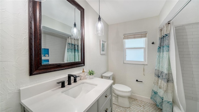 6990 Richardson Rd, Sarasota, FL 34240 - full bath with vanity, toilet, tile patterned flooring, shower / tub combo with curtain, and a textured wall