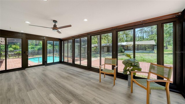 6990 Richardson Rd, Sarasota, FL 34240 - sunroom featuring plenty of natural light, wood finished floors, and recessed lighting