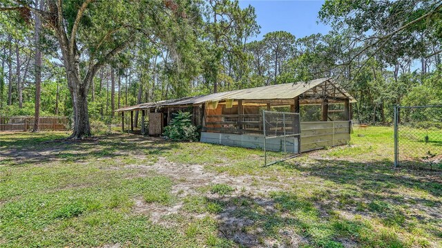 6990 Richardson Rd, Sarasota, FL 34240 - view of yard featuring an outdoor structure and an exterior structure