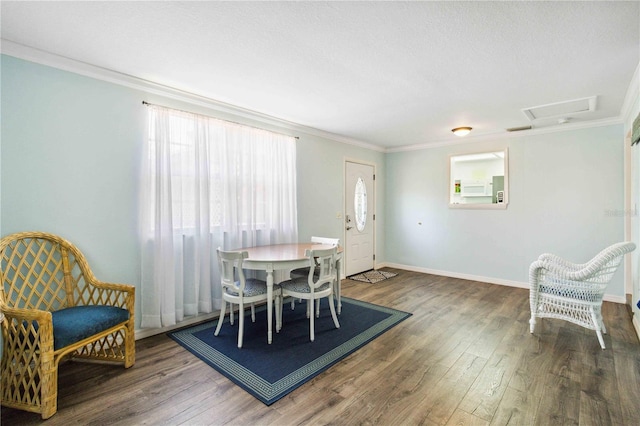3102 SE 34th Ave, Okeechobee, FL 34974 - dining area featuring healthy amount of natural light, wood finished floors, crown molding, and baseboards