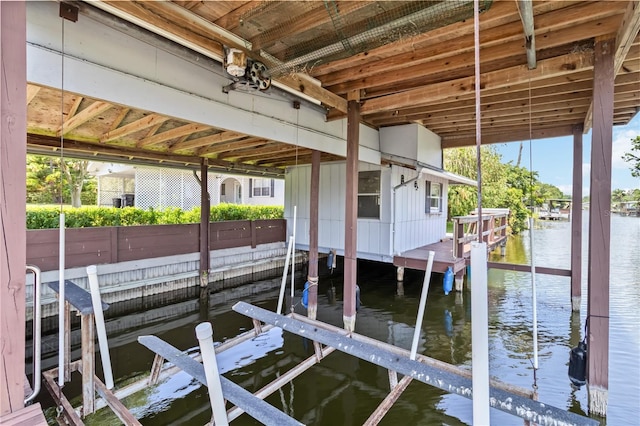 3102 SE 34th Ave, Okeechobee, FL 34974 - dock area featuring boat lift and a water view