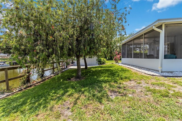 3102 SE 34th Ave, Okeechobee, FL 34974 - view of green lawn featuring a sunroom and a ceiling fan