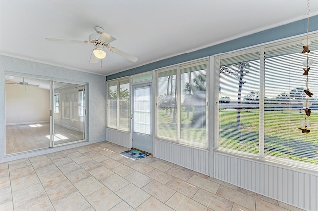 645 Liberty St, Englewood, FL 34223 - unfurnished sunroom featuring a ceiling fan