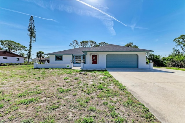 645 Liberty St, Englewood, FL 34223 - ranch-style house featuring stucco siding, concrete driveway, and an attached garage
