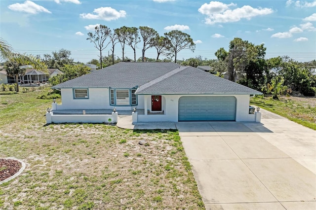 645 Liberty St, Englewood, FL 34223 - single story home with concrete driveway, stucco siding, an attached garage, and a shingled roof