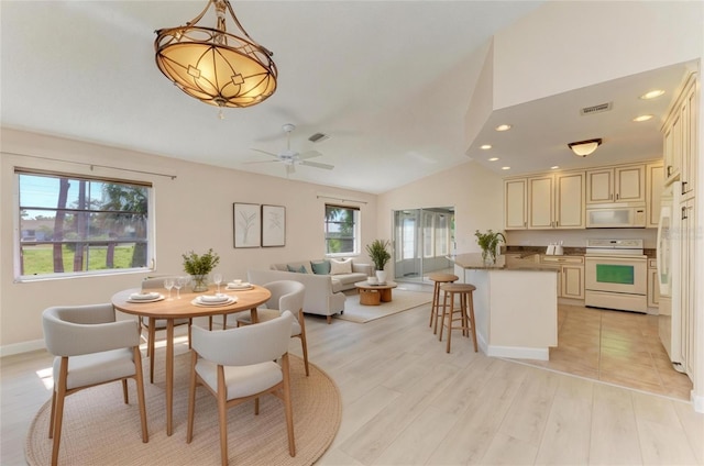 645 Liberty St, Englewood, FL 34223 - dining area with vaulted ceiling, recessed lighting, light wood finished floors, and ceiling fan