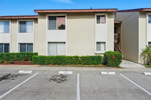 2704 Hidden Lake Blvd Unit C, Sarasota, FL 34237 - view of building exterior featuring uncovered parking