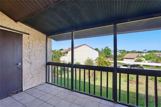 2704 Hidden Lake Blvd Unit C, Sarasota, FL 34237 - unfurnished sunroom featuring a residential view