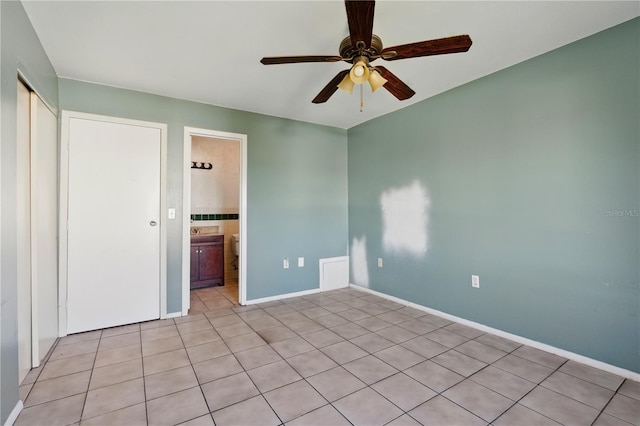 2704 Hidden Lake Blvd Unit C, Sarasota, FL 34237 - unfurnished bedroom featuring light tile patterned flooring and ceiling fan