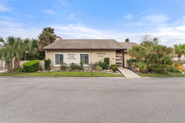 2704 Hidden Lake Blvd Unit C, Sarasota, FL 34237 - view of property featuring stucco siding