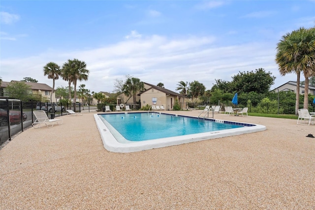 2704 Hidden Lake Blvd Unit C, Sarasota, FL 34237 - community pool featuring a patio area and a residential view