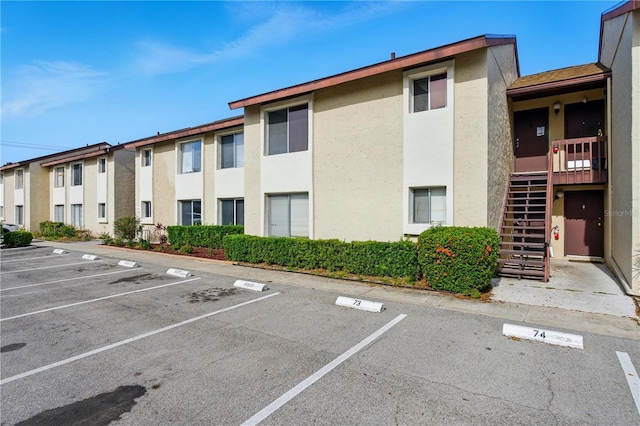 2704 Hidden Lake Blvd Unit C, Sarasota, FL 34237 - view of building exterior with uncovered parking and stairs