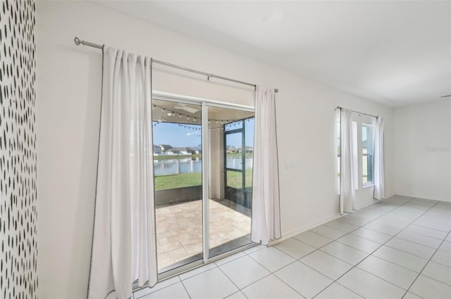 4503 Lindever Ln, Palmetto, FL 34221 - unfurnished room featuring healthy amount of natural light, a water view, and light tile patterned flooring