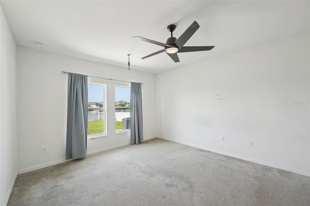4503 Lindever Ln, Palmetto, FL 34221 - spare room featuring carpet, a ceiling fan, baseboards, and a water view