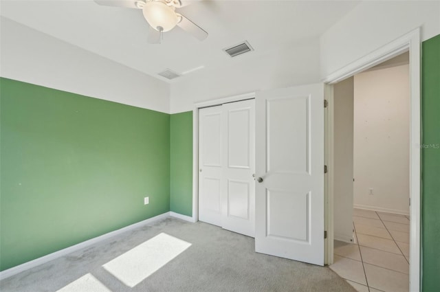 4503 Lindever Ln, Palmetto, FL 34221 - unfurnished bedroom featuring a closet, baseboards, ceiling fan, and light colored carpet