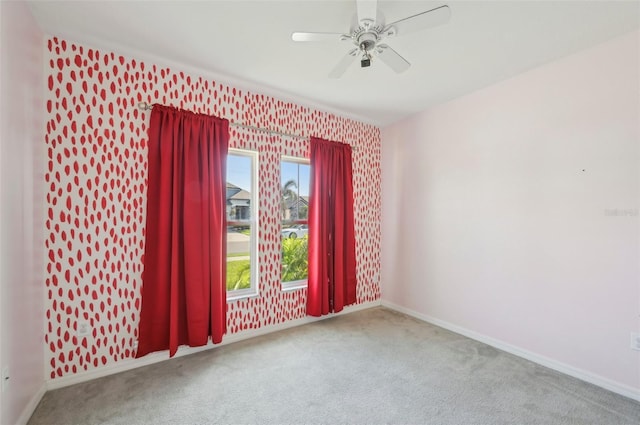 4503 Lindever Ln, Palmetto, FL 34221 - empty room with carpet floors, baseboards, ceiling fan, and wallpapered walls
