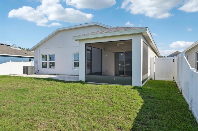 4503 Lindever Ln, Palmetto, FL 34221 - rear view of house with a sunroom, stucco siding, central air condition unit, and a patio