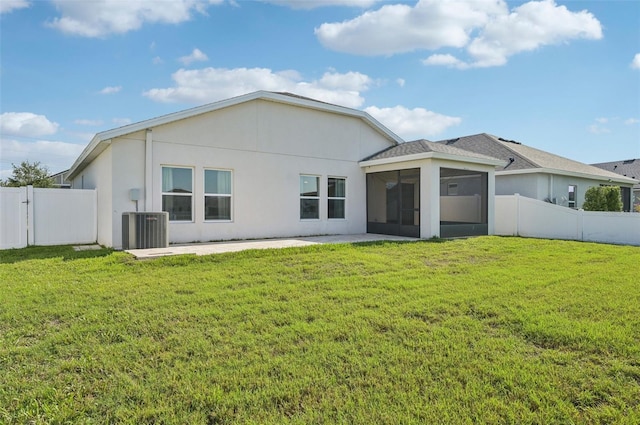 4503 Lindever Ln, Palmetto, FL 34221 - back of property with a sunroom, central AC unit, a patio, and stucco siding