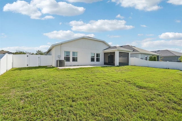 4503 Lindever Ln, Palmetto, FL 34221 - rear view of property with central AC unit, a sunroom, a gate, a patio area, and stucco siding