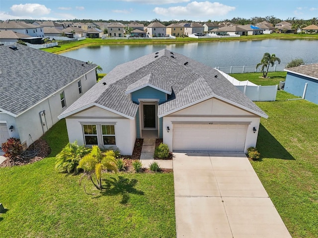 4503 Lindever Ln, Palmetto, FL 34221 - view of front of house featuring a garage, a residential view, roof with shingles, and a water view
