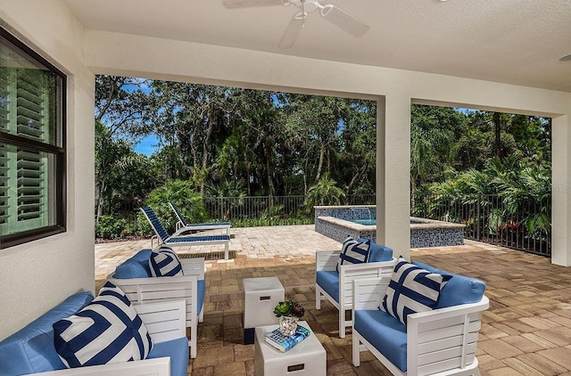 21225 Wacissa Dr, Venice, FL 34293 - view of patio / terrace with outdoor lounge area, ceiling fan, an outdoor hot tub, and view of scattered trees