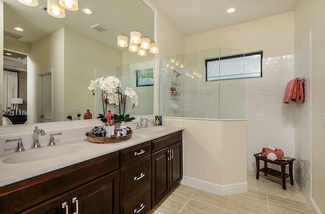 21225 Wacissa Dr, Venice, FL 34293 - full bath featuring double vanity, a walk in shower, tile patterned flooring, recessed lighting, and a chandelier