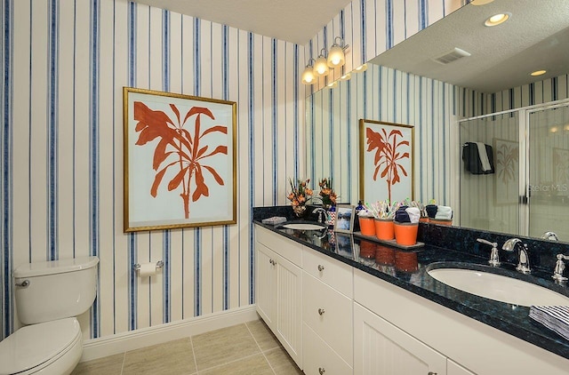 21225 Wacissa Dr, Venice, FL 34293 - bathroom with double vanity, a shower stall, toilet, tile patterned flooring, and baseboards