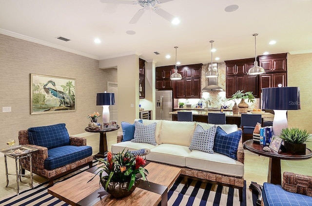 21225 Wacissa Dr, Venice, FL 34293 - living room featuring a ceiling fan, crown molding, and recessed lighting