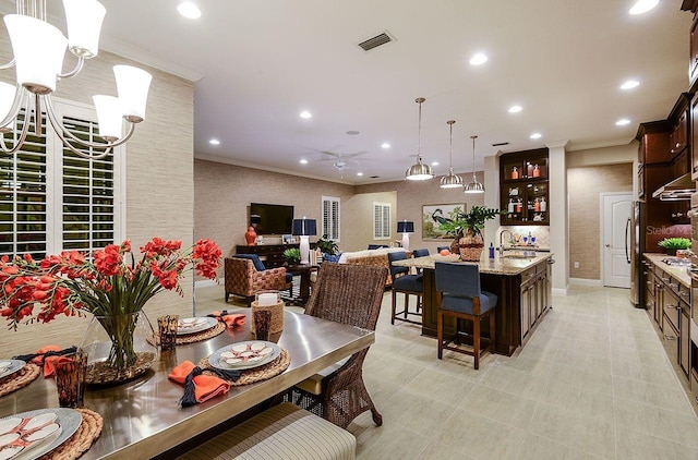 21225 Wacissa Dr, Venice, FL 34293 - dining area featuring crown molding, a ceiling fan, recessed lighting, and baseboards