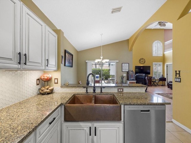 8222 Haven Harbour Way, Bradenton, FL 34212 - kitchen featuring dishwasher, a sink, a chandelier, decorative backsplash, and a peninsula
