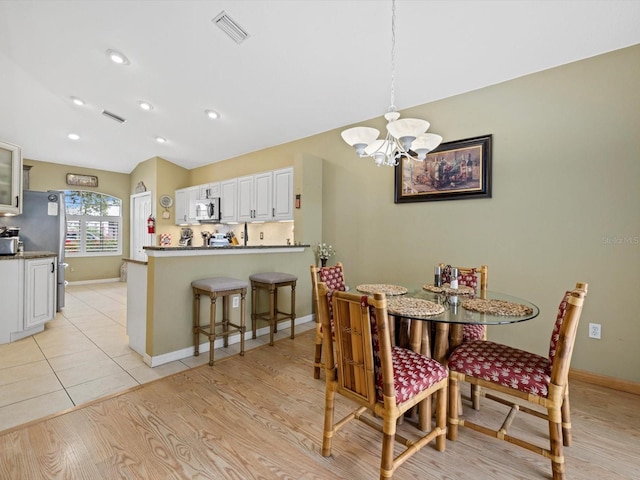 8222 Haven Harbour Way, Bradenton, FL 34212 - dining room featuring a chandelier, baseboards, recessed lighting, and light tile patterned floors