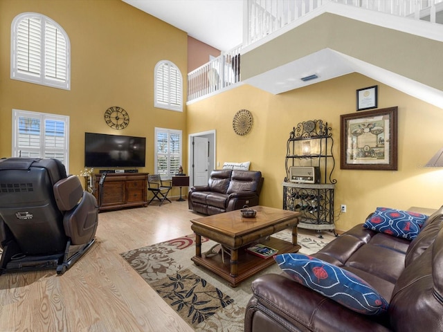 8222 Haven Harbour Way, Bradenton, FL 34212 - living area featuring a towering ceiling and wood finished floors
