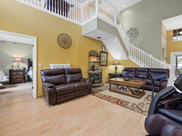 8222 Haven Harbour Way, Bradenton, FL 34212 - living area with a high ceiling, wood finished floors, stairs, and baseboards