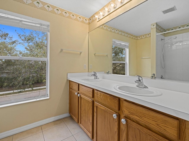 8222 Haven Harbour Way, Bradenton, FL 34212 - bathroom featuring tile patterned floors, double vanity, baseboards, and a shower